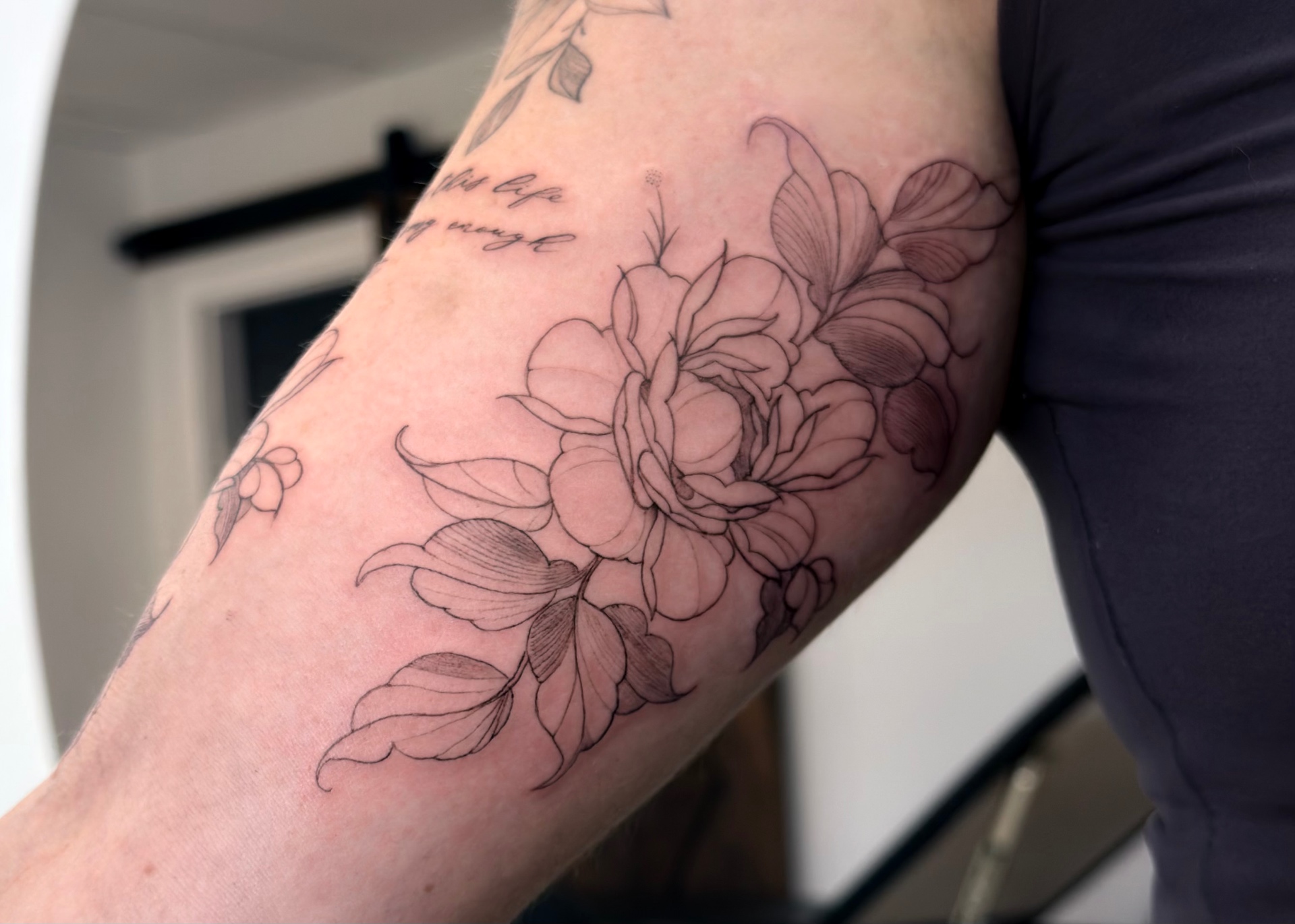 Fine line rose tattoo
